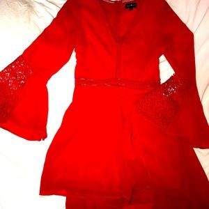 Red romper with train